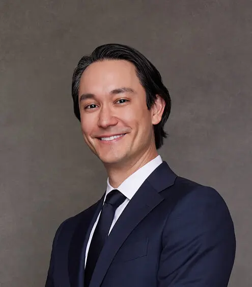 headshot of Dr. Delaney in his suit