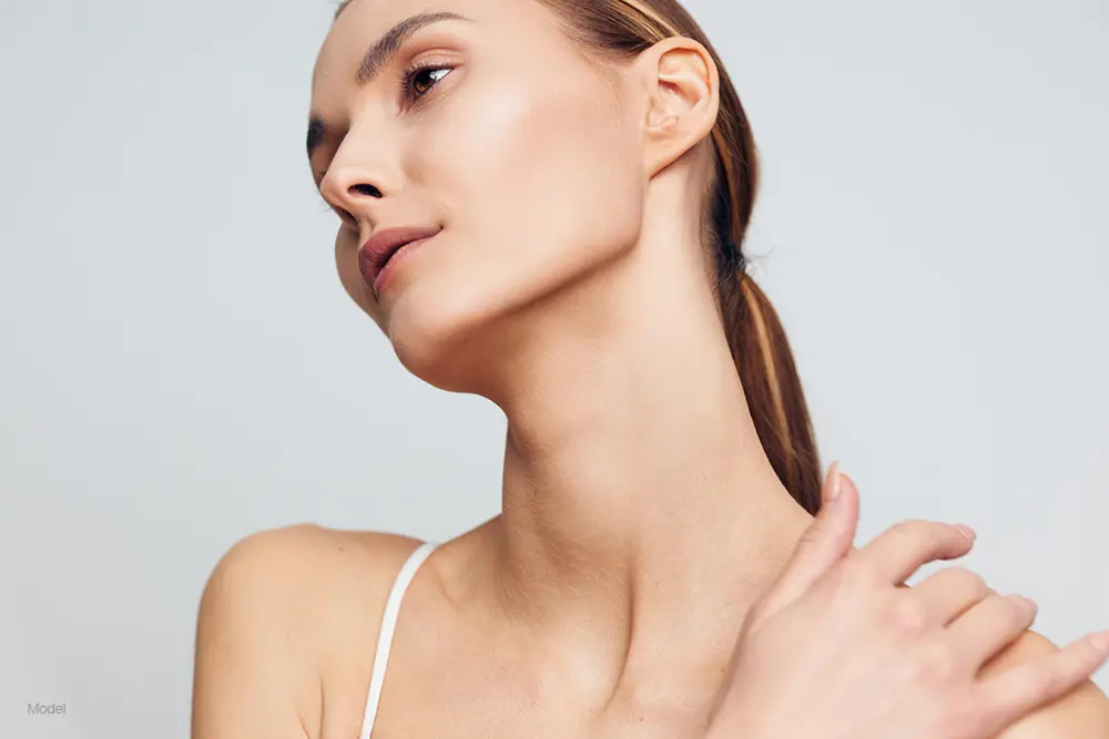 Profile of a young woman in white shirt