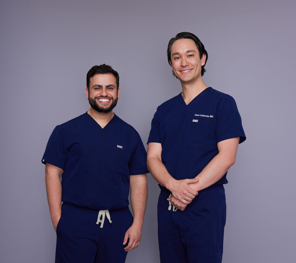 Dr. Delaney and Dr. Hamati in their scrubs